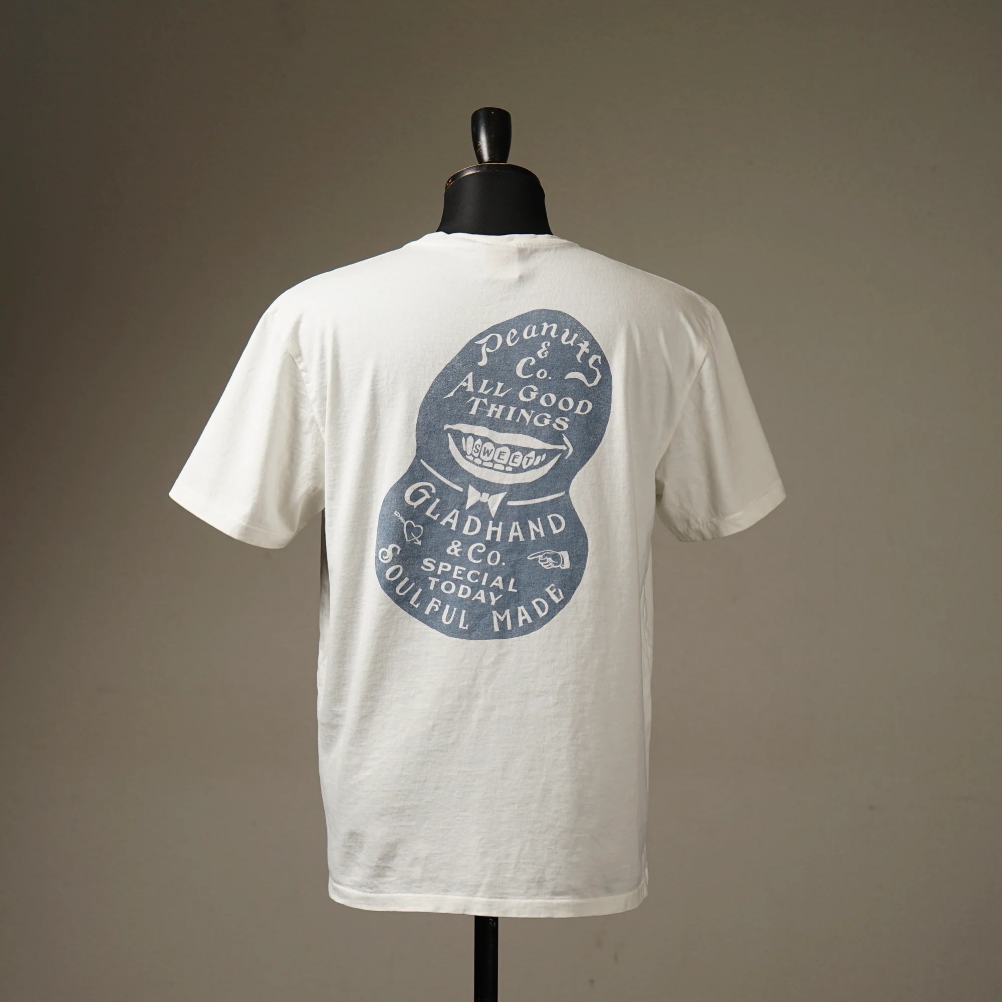 Glad Hand & Co x Peanuts & Co. Mr.Smiley T-Shirt – BROGUE Glad Hand & Co x Peanuts & Co. Mr.Smiley T-Shirt – BROGUE